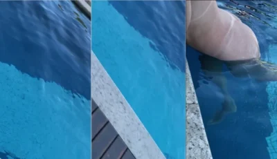 Dani Coelhinha sorrindo enquanto se exibe toda na piscina