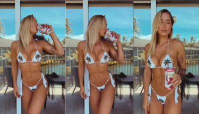 Bru Luccas se exibindo de roupa intima enquanto bebe uma cerveja