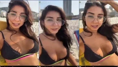 Renatinha Mello se exibindo de biquíni na praia